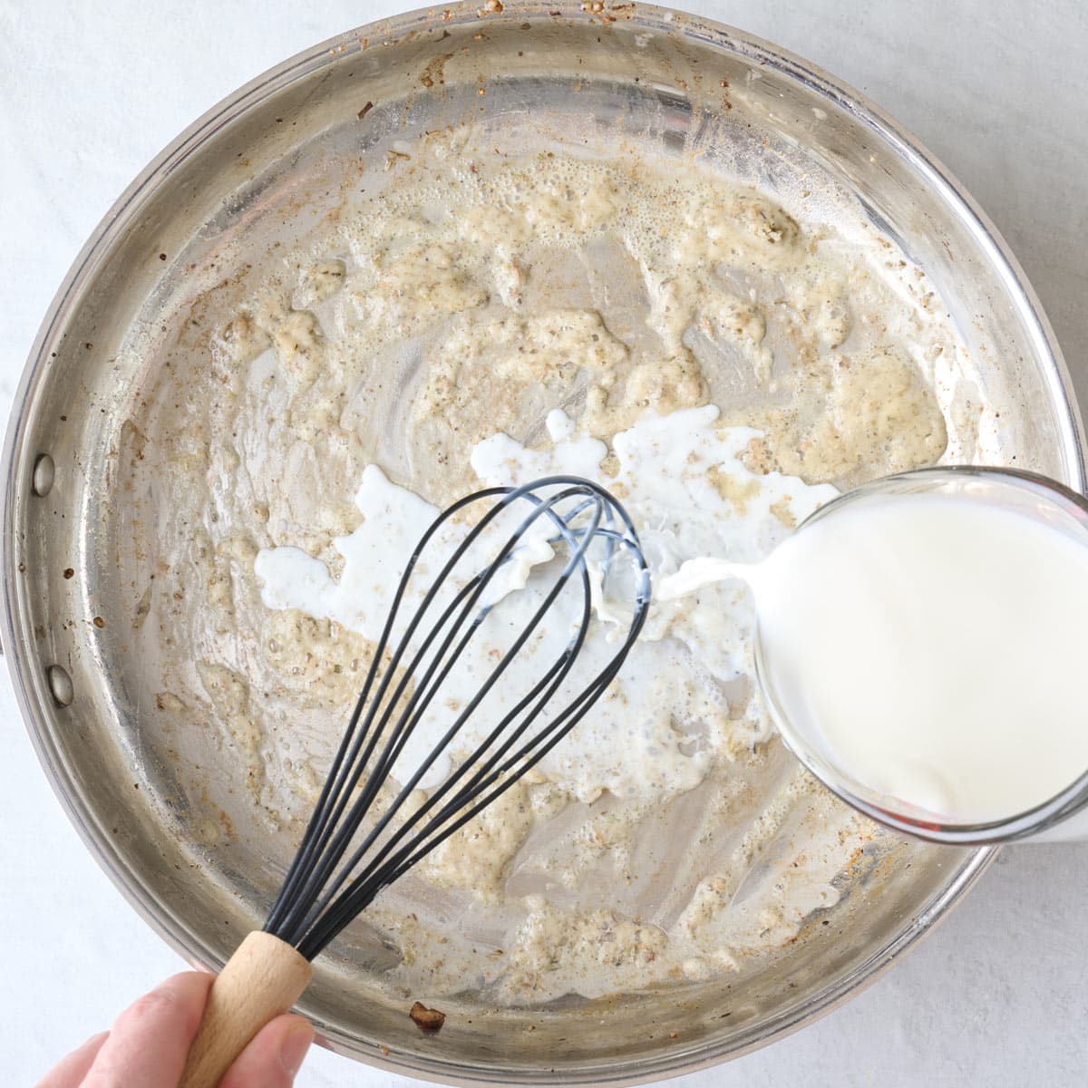 Whisking in milk.