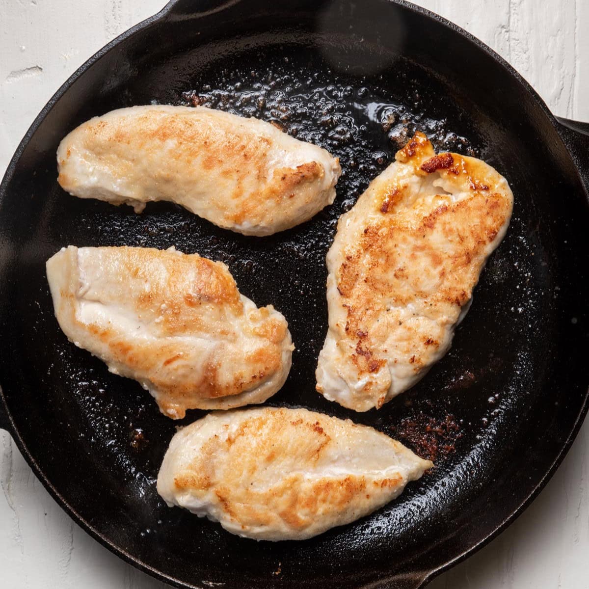After flipping chicken to show golden crust.