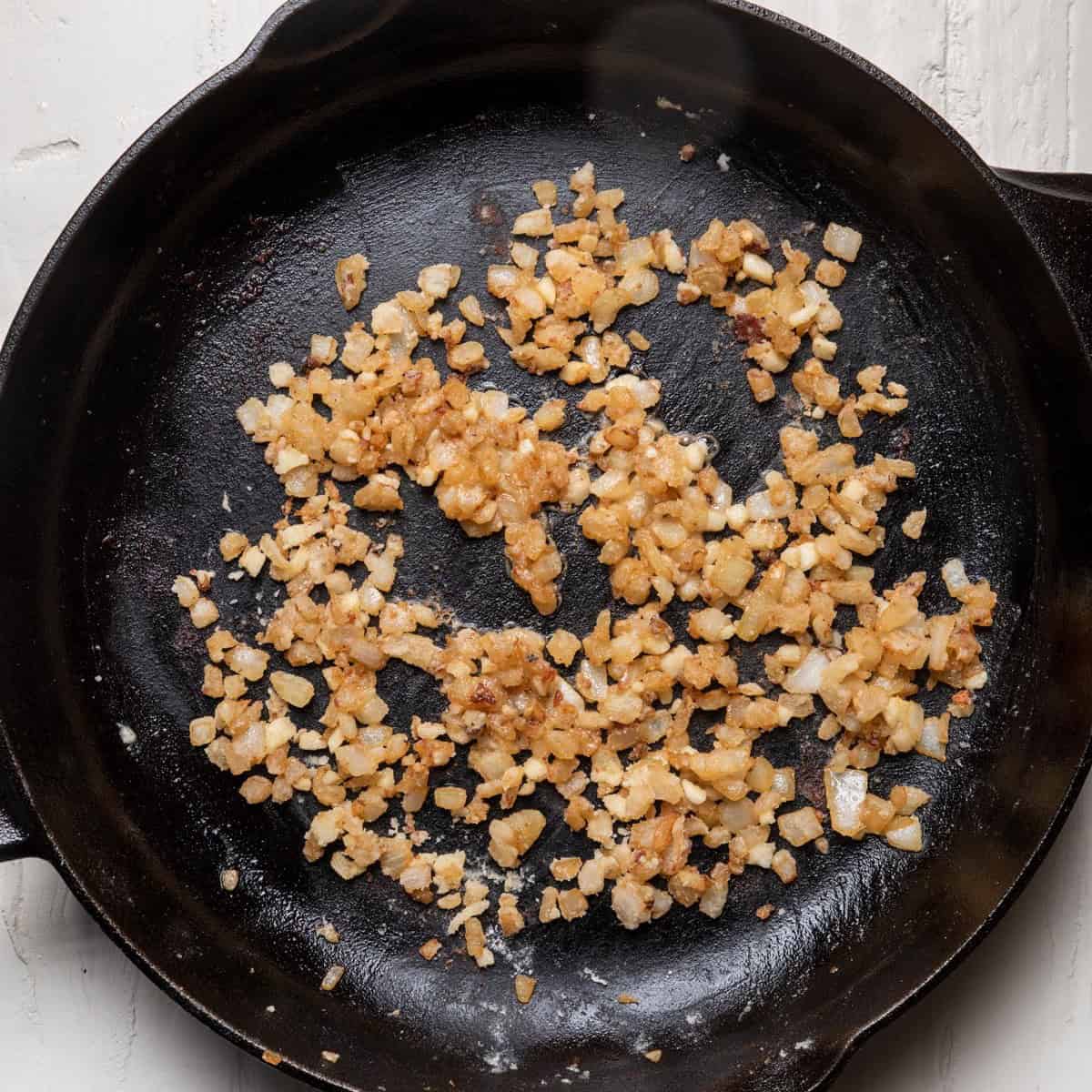 Diced onions after cooking in skillet.