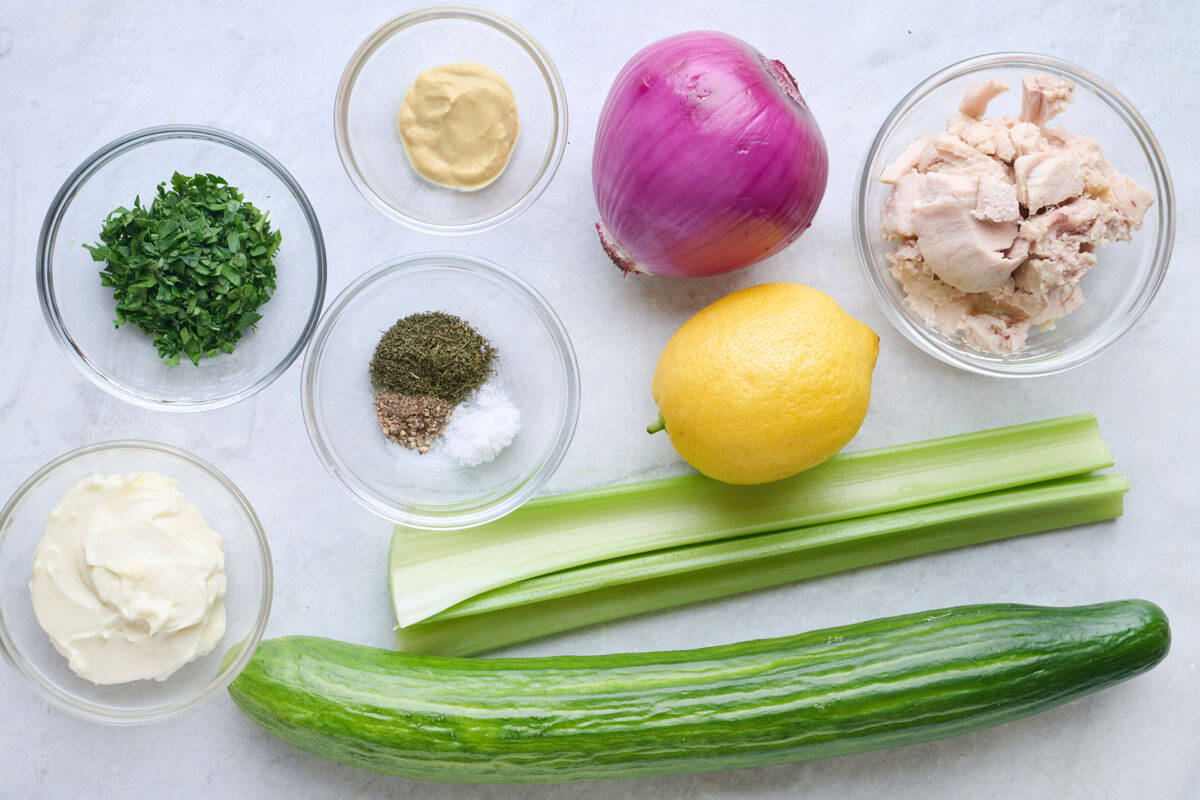Ingredients for recipe: English cucumber, tuna, red onion, lemon, seasonings, Dijon mustard, mayonnaise, and chopped parsley.