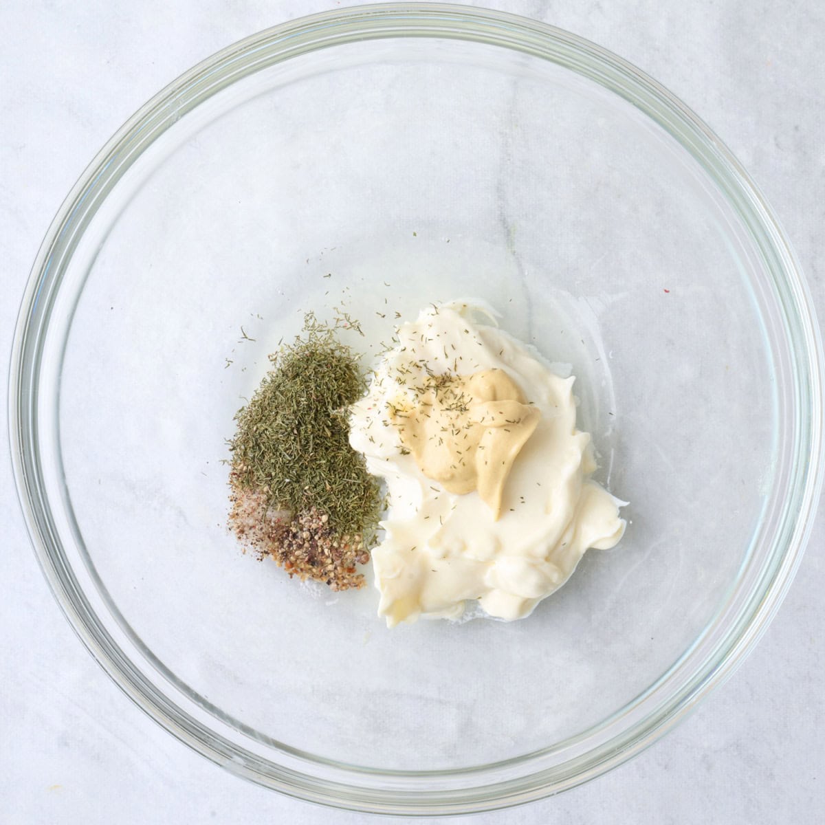 Mayo, lemon juice, mustard, dill, salt and pepper in a small bowl.