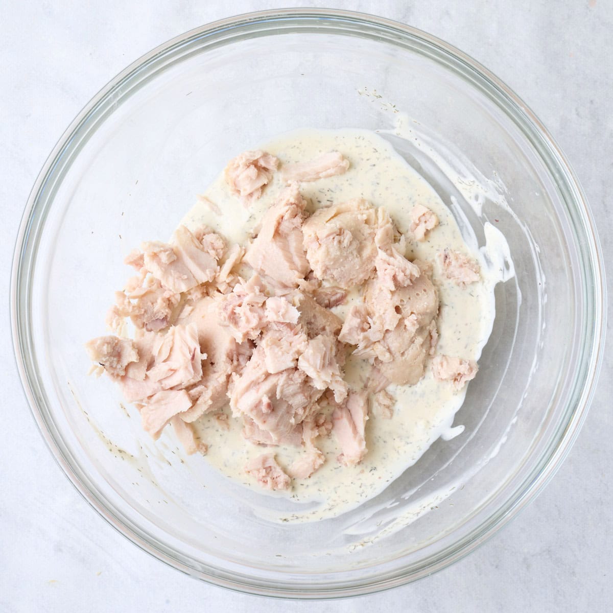 Tuna added on top of dressing.