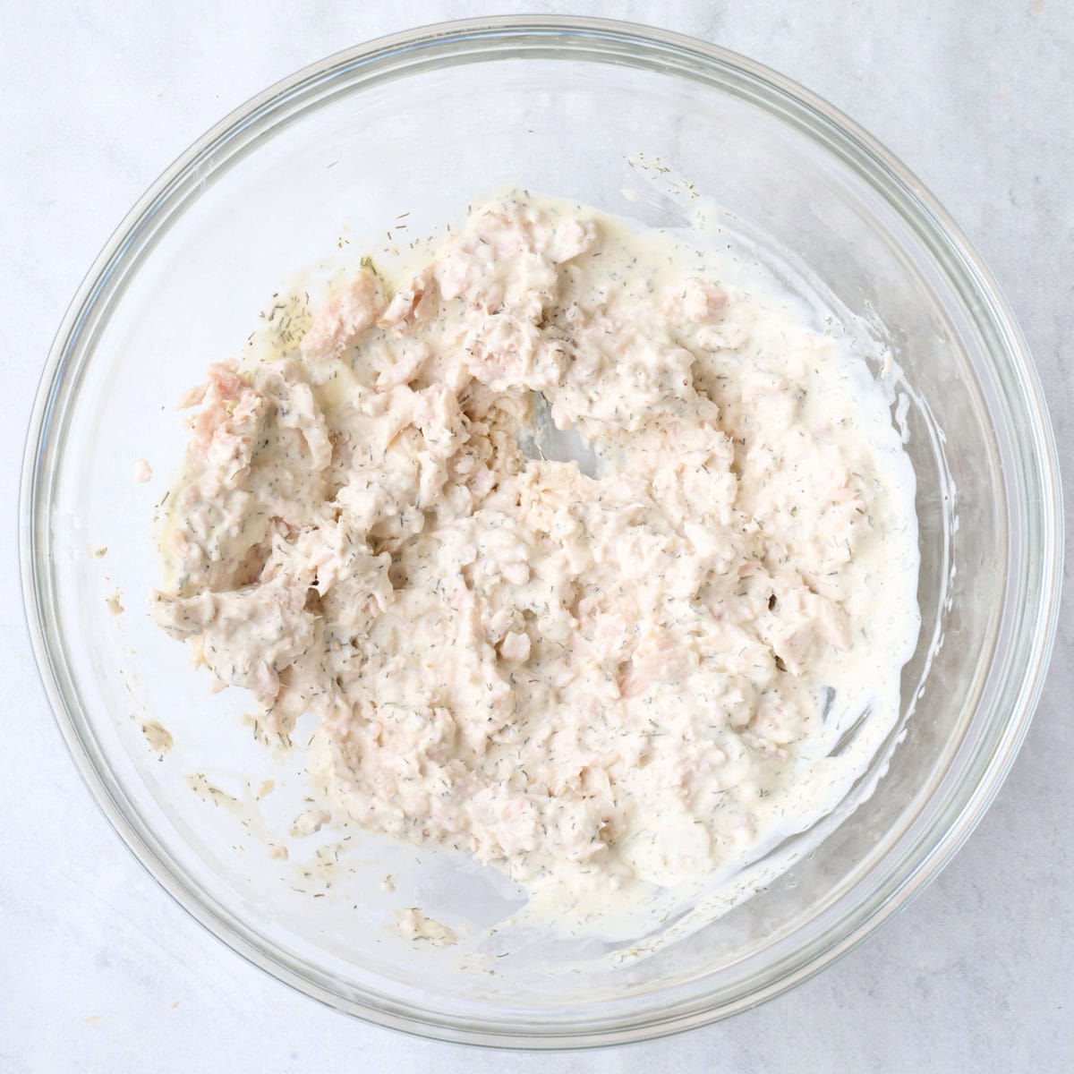After flaking tuna and combining with dressing.