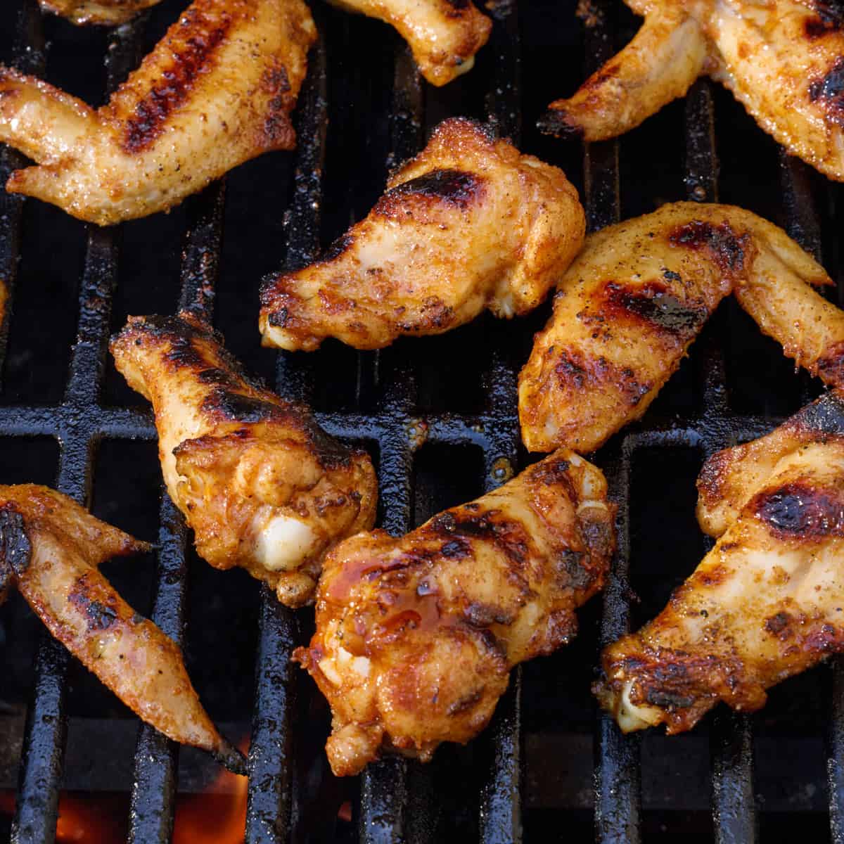 After cooking chicken wings on grill to show grill marks and caramelized skin.