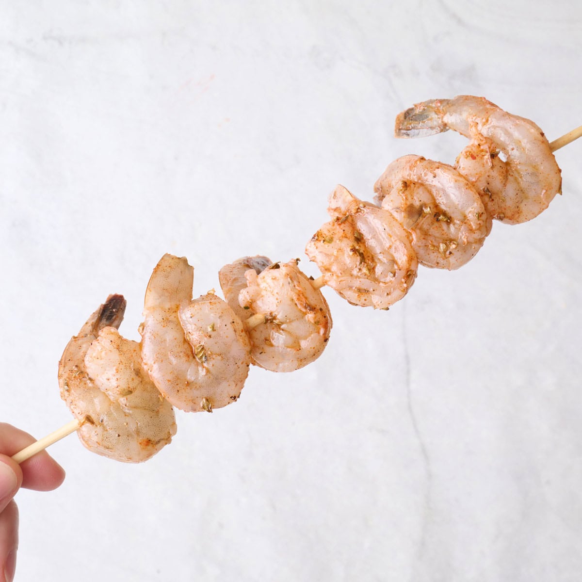 Shrimp threaded onto skewers.