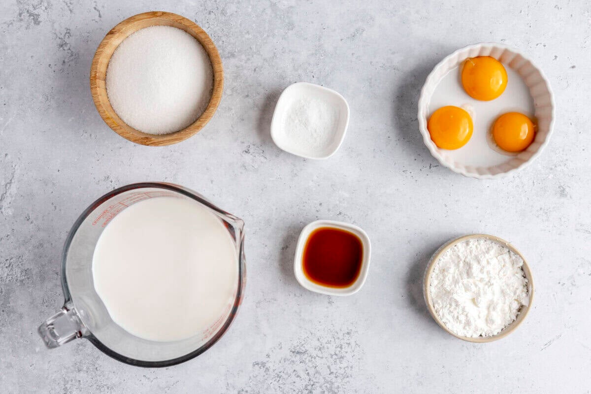 Ingredients for recipe: sugar, milk, salt, vanilla, egg yolks, and cornstarch.
