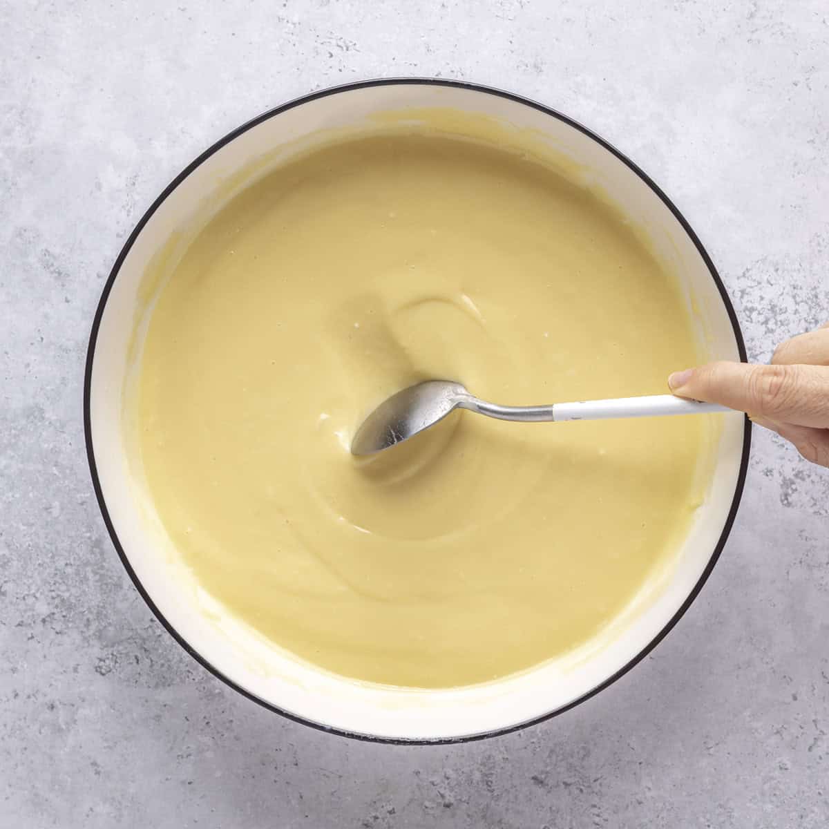 After fully chilled with a spoon scraping off the top to show consistency.