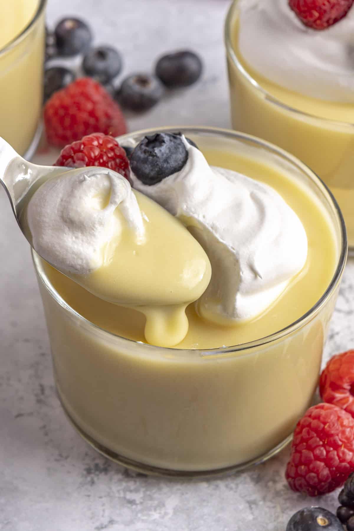 Spoon lifting up a bite of creamy homemade pudding.