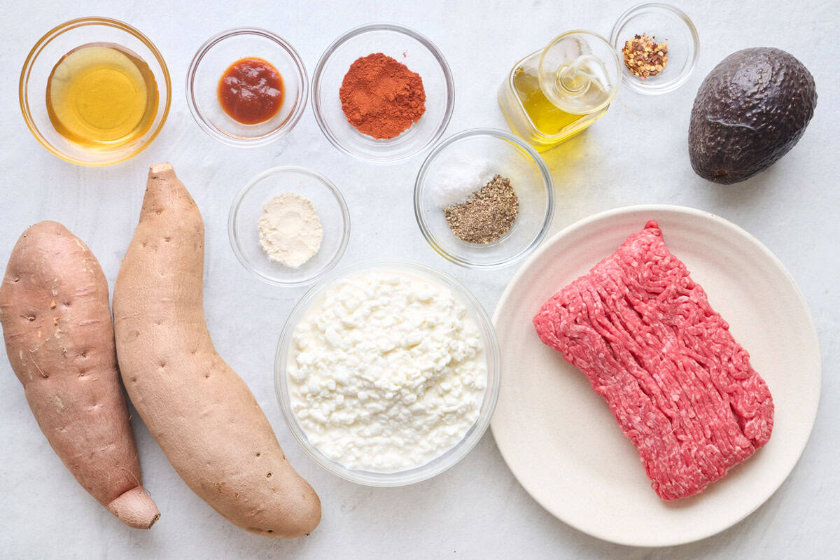 Ingredients for recipe: honey, sriracha, paprika, garlic powder, salt and pepper, oil, red pepper flakes, avocado, sweet potatoes, cottage cheese and ground beef.