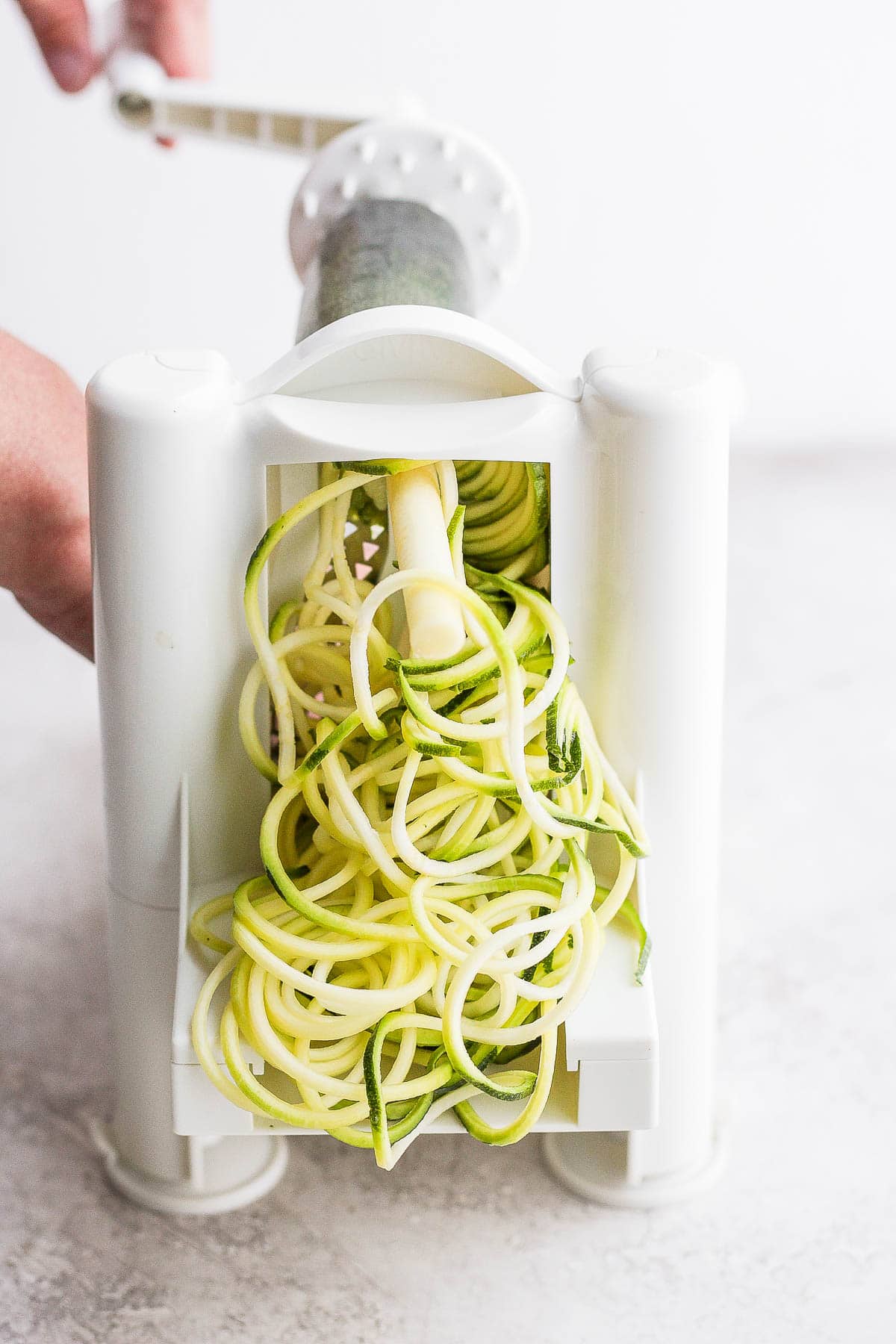 Spiralize zucchini in a spiralizer.