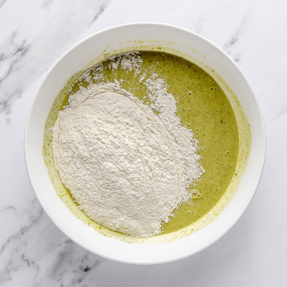 Dry ingredients added to wet mixture.