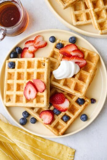 Easy protein waffles recipe on a plate with fresh berries.