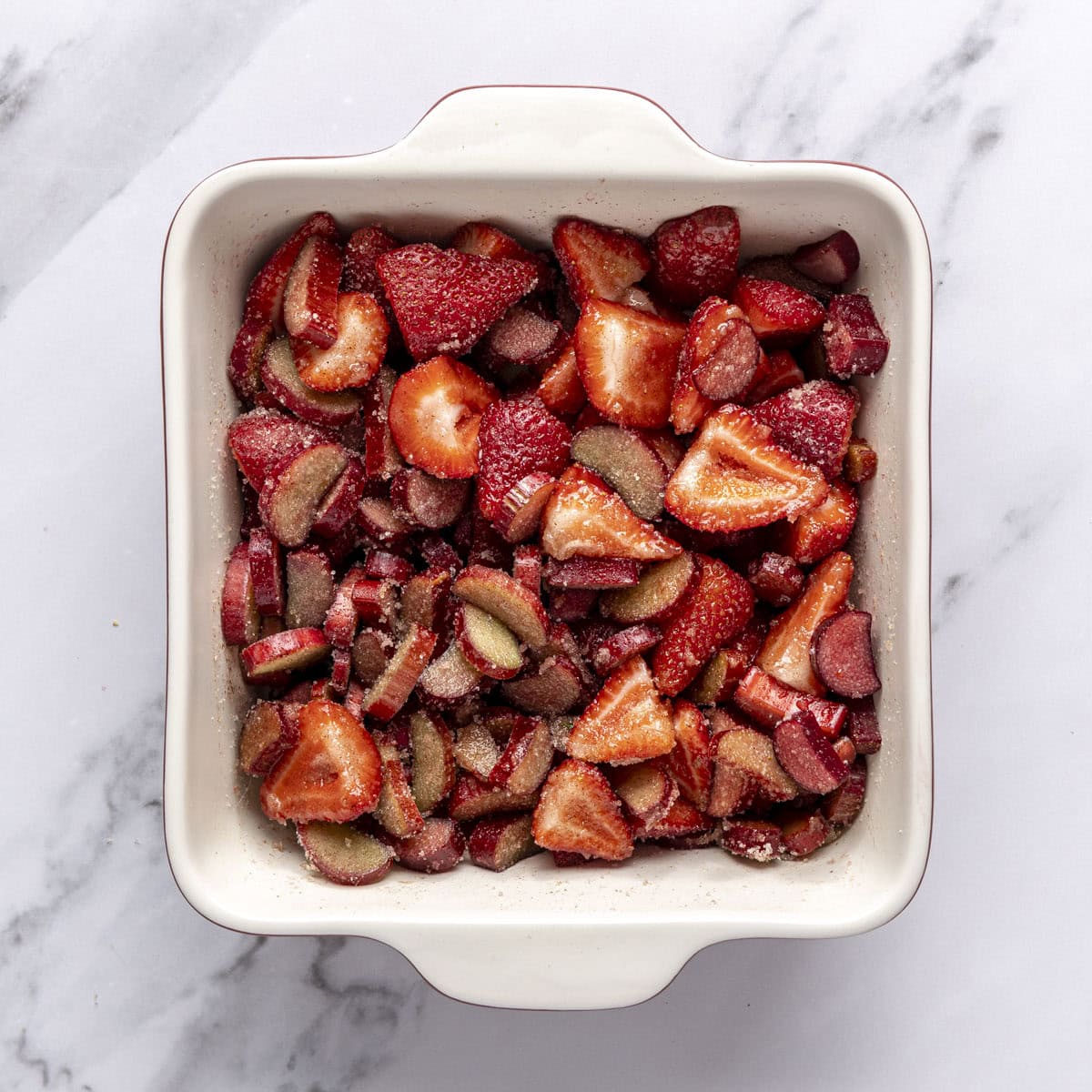 After tossing chopped fruit with spiced sugar.
