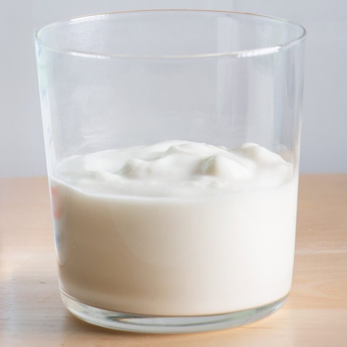 Yogurt in a small glass.