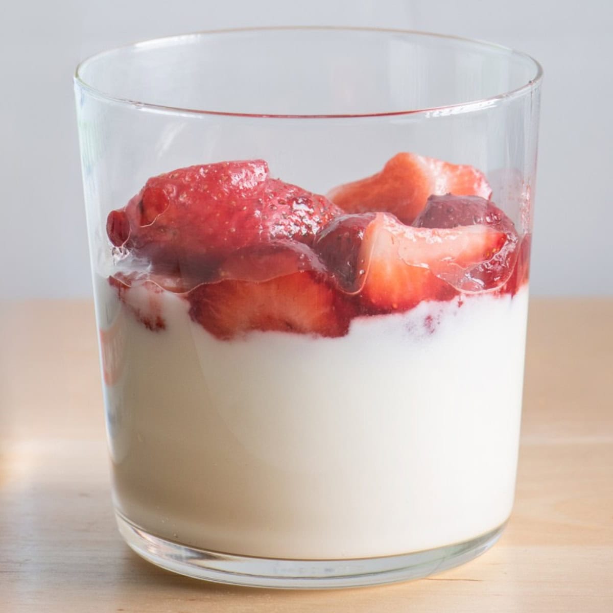 Strawberries added on top of yogurt.