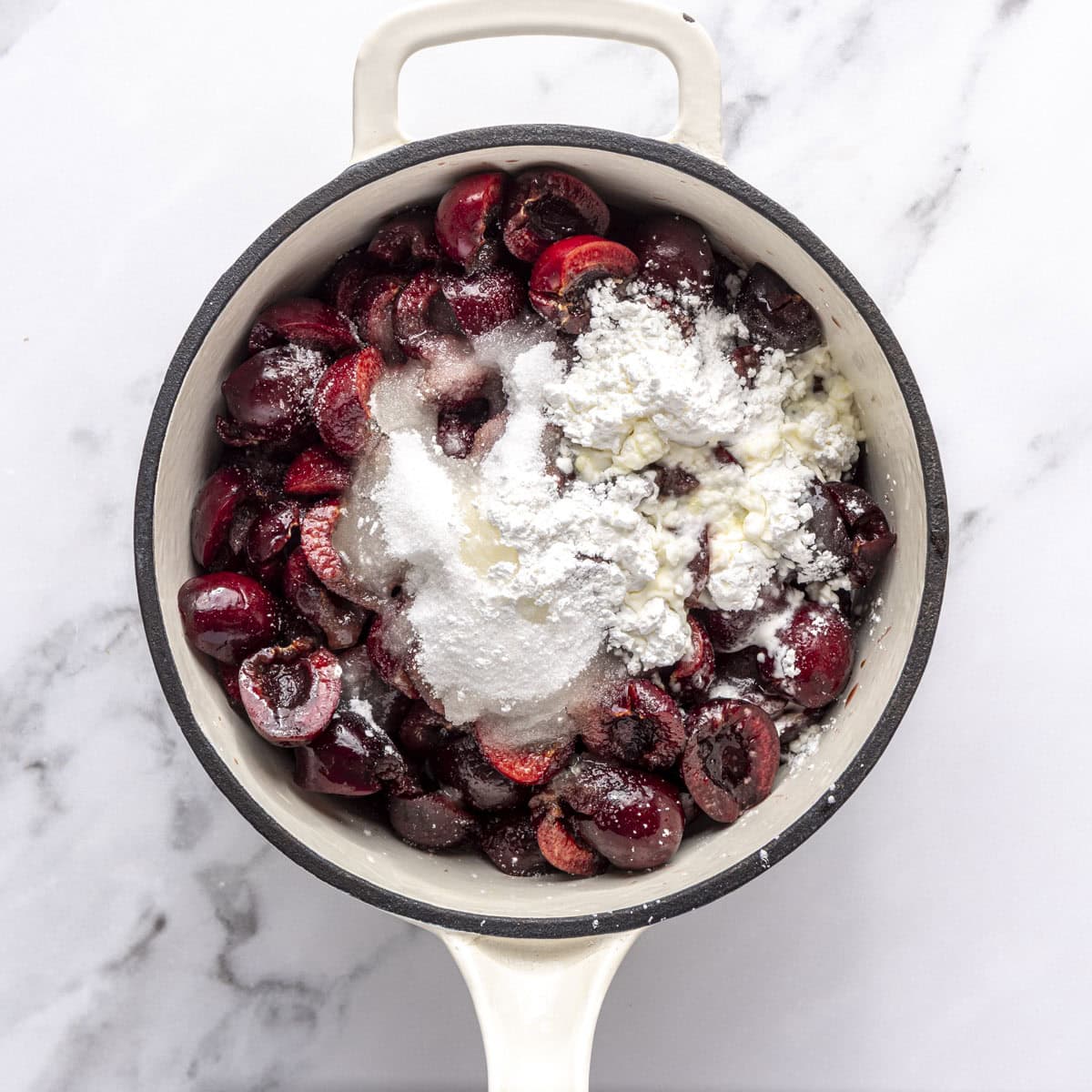Cherries, sugar, cornstarch, lemon juice, almond extract and salt in a saucepan before mixing.
