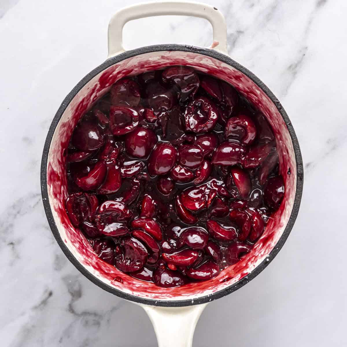 After heating cherries until they are tender and the sauce has thickened.