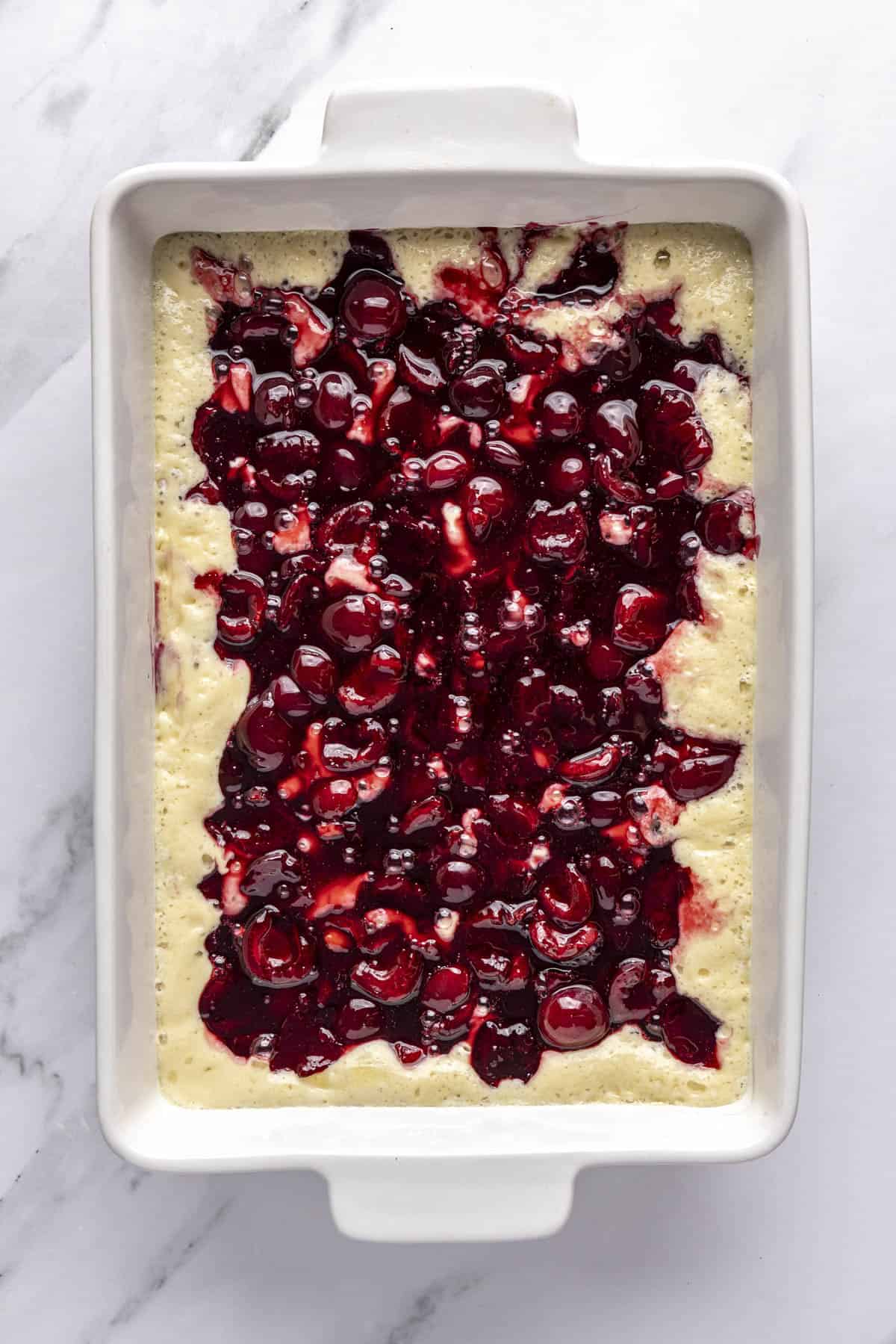 After spooning cherry mixture over batter.