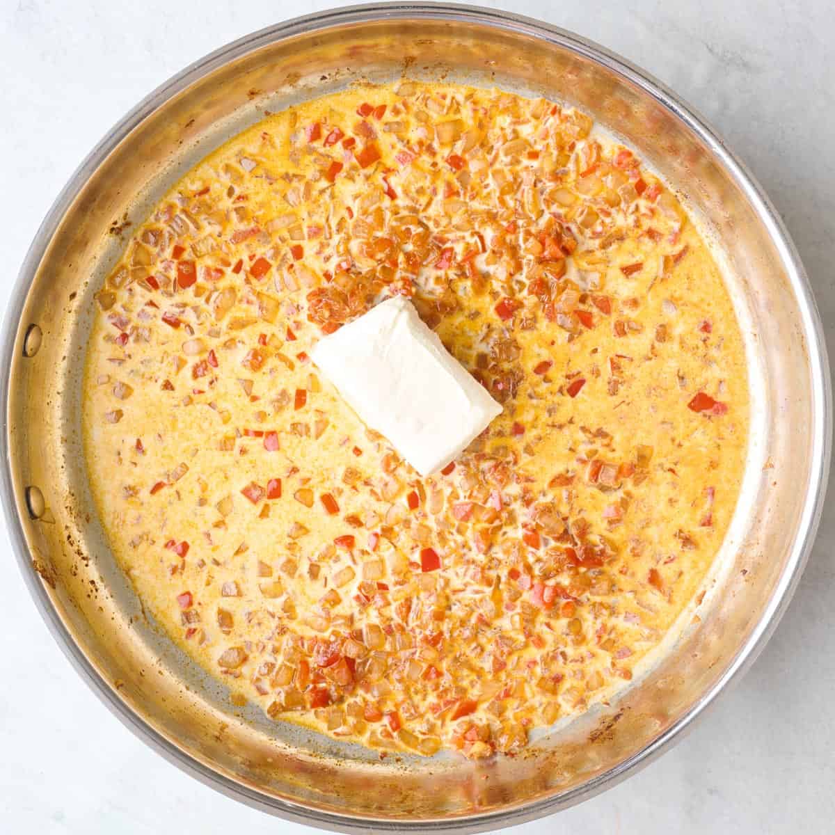 Milk and cream cheese added before stirring.