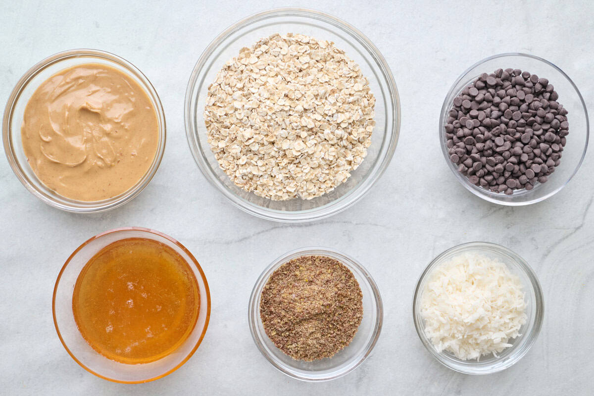 Ingredients for recipe: peanut butter, honey, rolled oats, ground flaxseed, shredded coconut and chocolate chips.