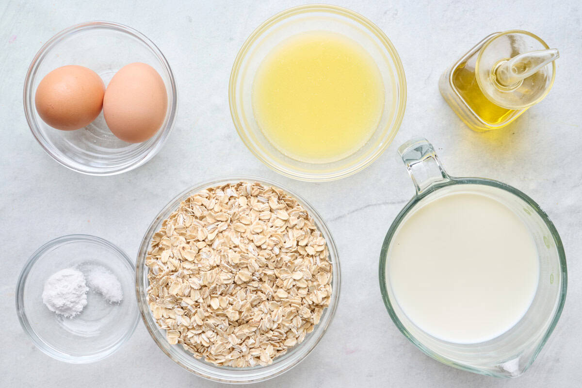 Ingredients for recipe: eggs, melted butter, oil, baking powder, salt, oats, and milk.