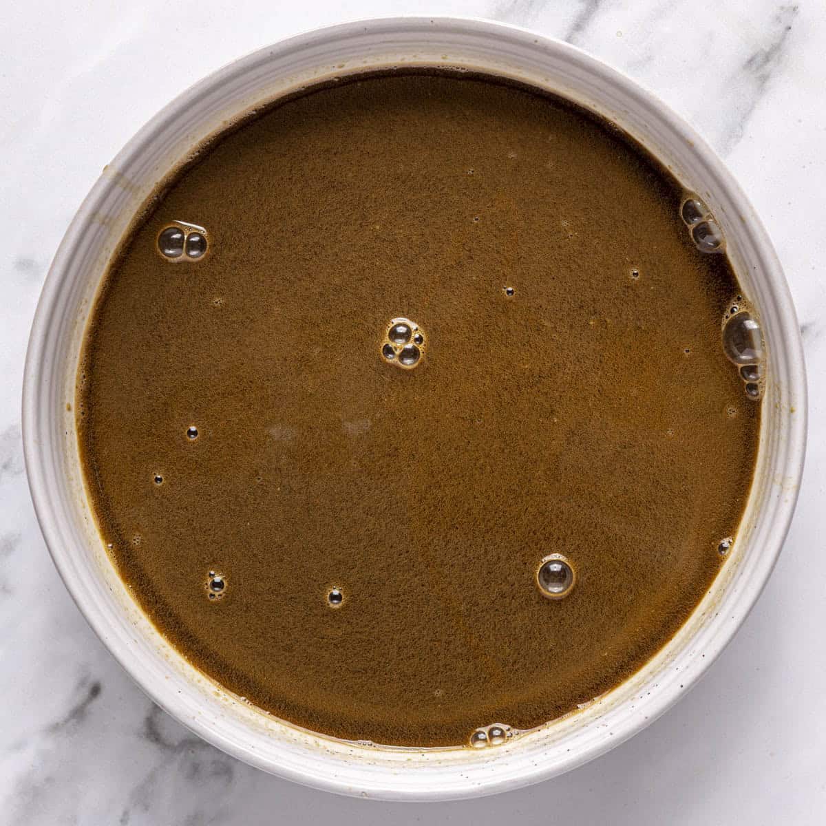 Pistachio espresso in a shallow bowl.