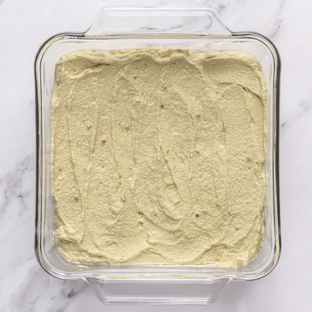 After spreading half of the pistachio mascarpone cream.
