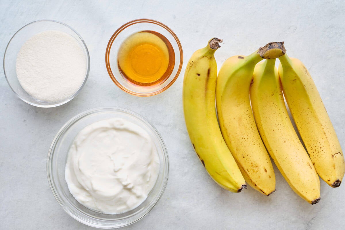 Ingredients for recipe: bananas, yogurt, protein powder, and honey.