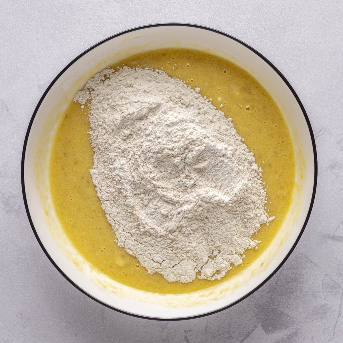Flour mixture added to the wet mixture before combining.