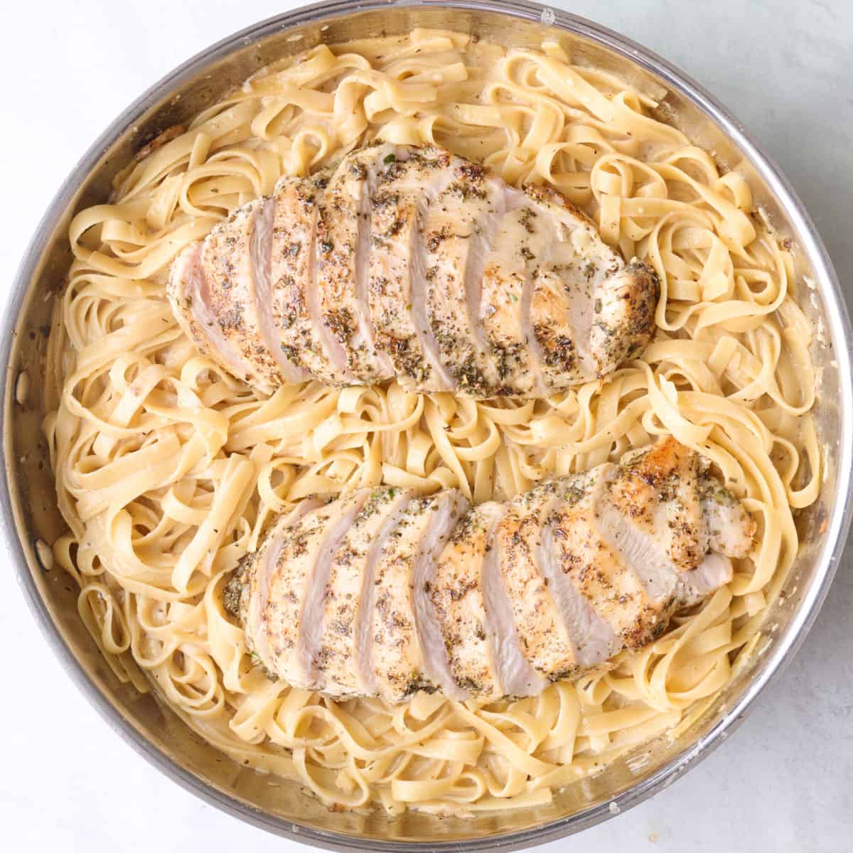 After tossing together and thickened with sliced chicken added on top.