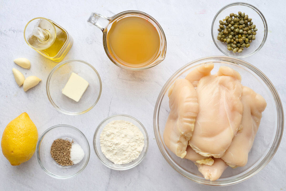 Ingredients for recipe: oil, garlic, lemon, butter, salt and pepper, flour, capers, broth and chicken breasts.