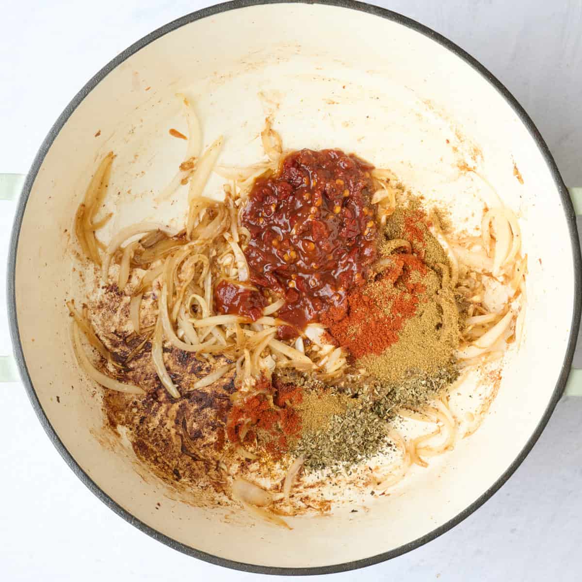 Chopped chipotle peppers and the sauce, paprika, cumin, oregano, and coriander added.