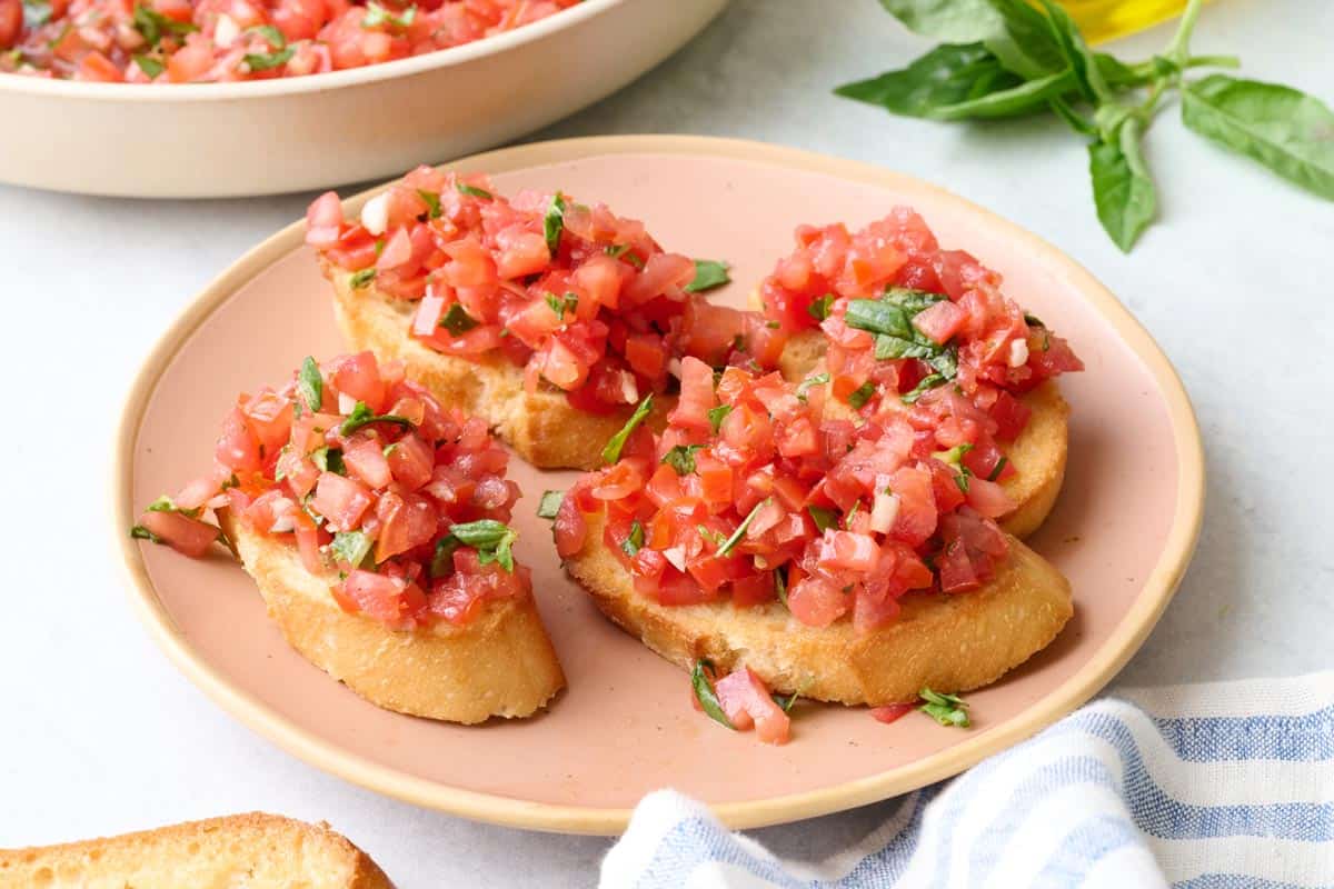 Tomato basil bruschetta on a plate.