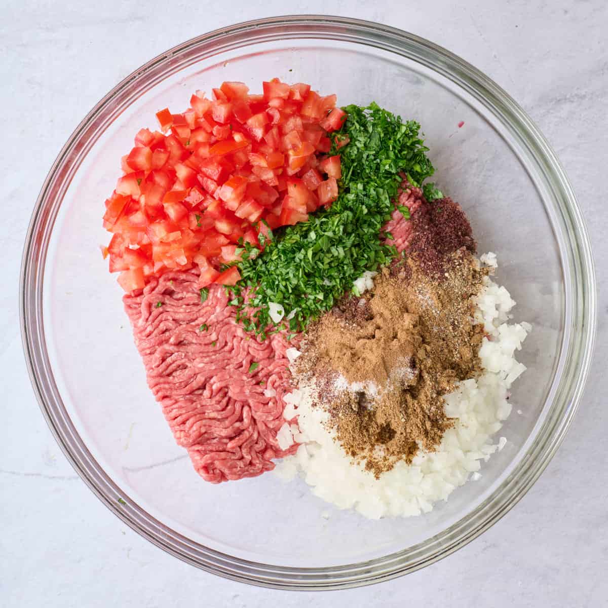 Meat mixture ingredients in a bowl.