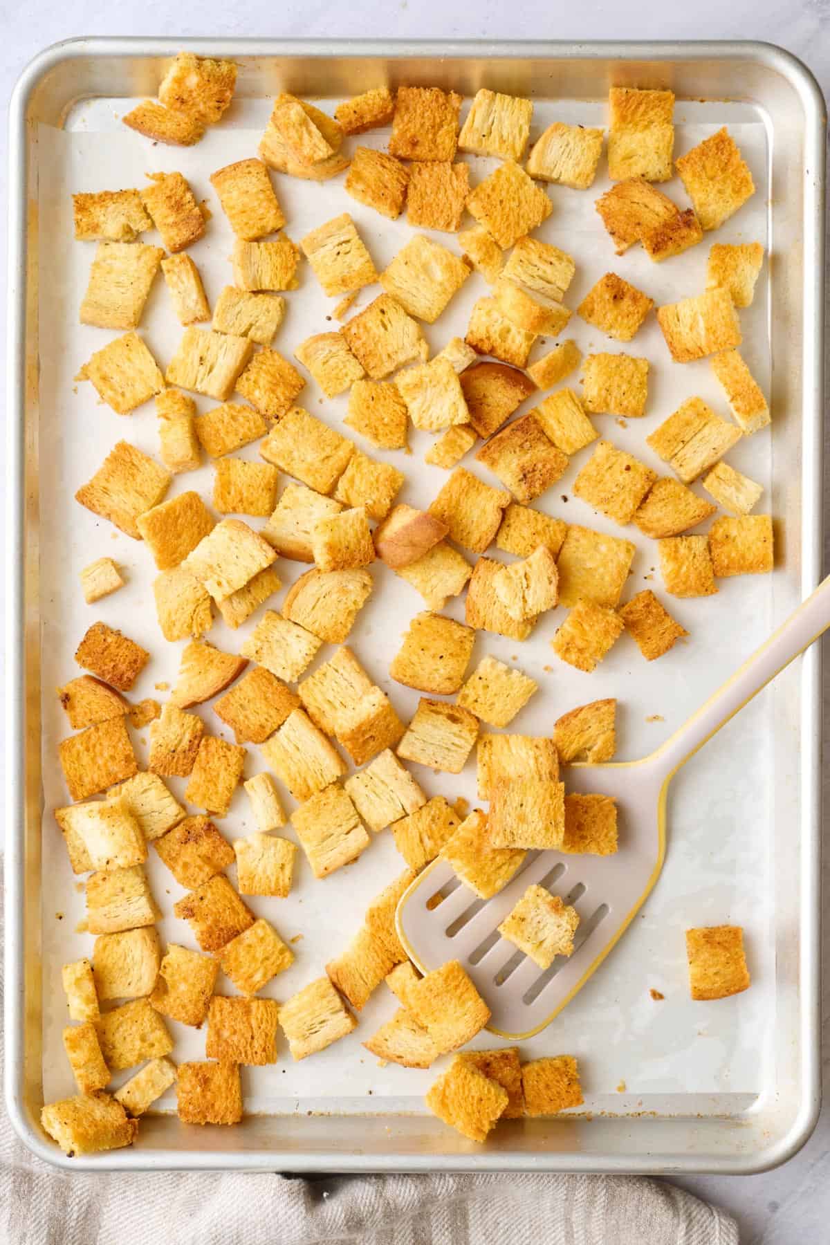 Best Homemade croutons on a sheet pan after baking.