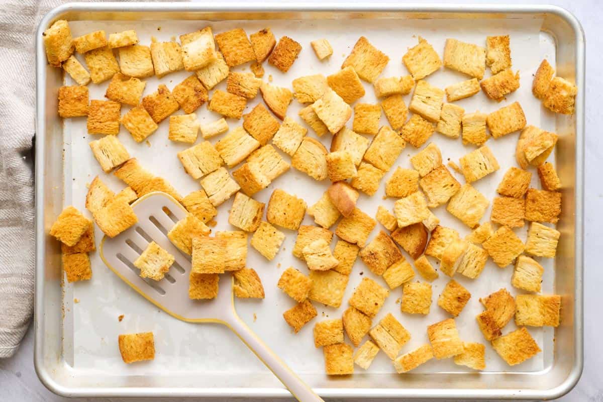 Homemade croutons on a sheet pan after baking.