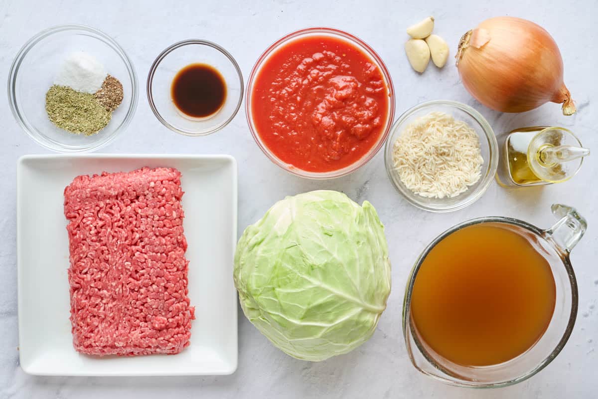 Ingredients for recipe: seasonings, ground beef, Worcestershire sauce, crushed tomatoes, cabbage, rice, garlic, onion, broth and oil.