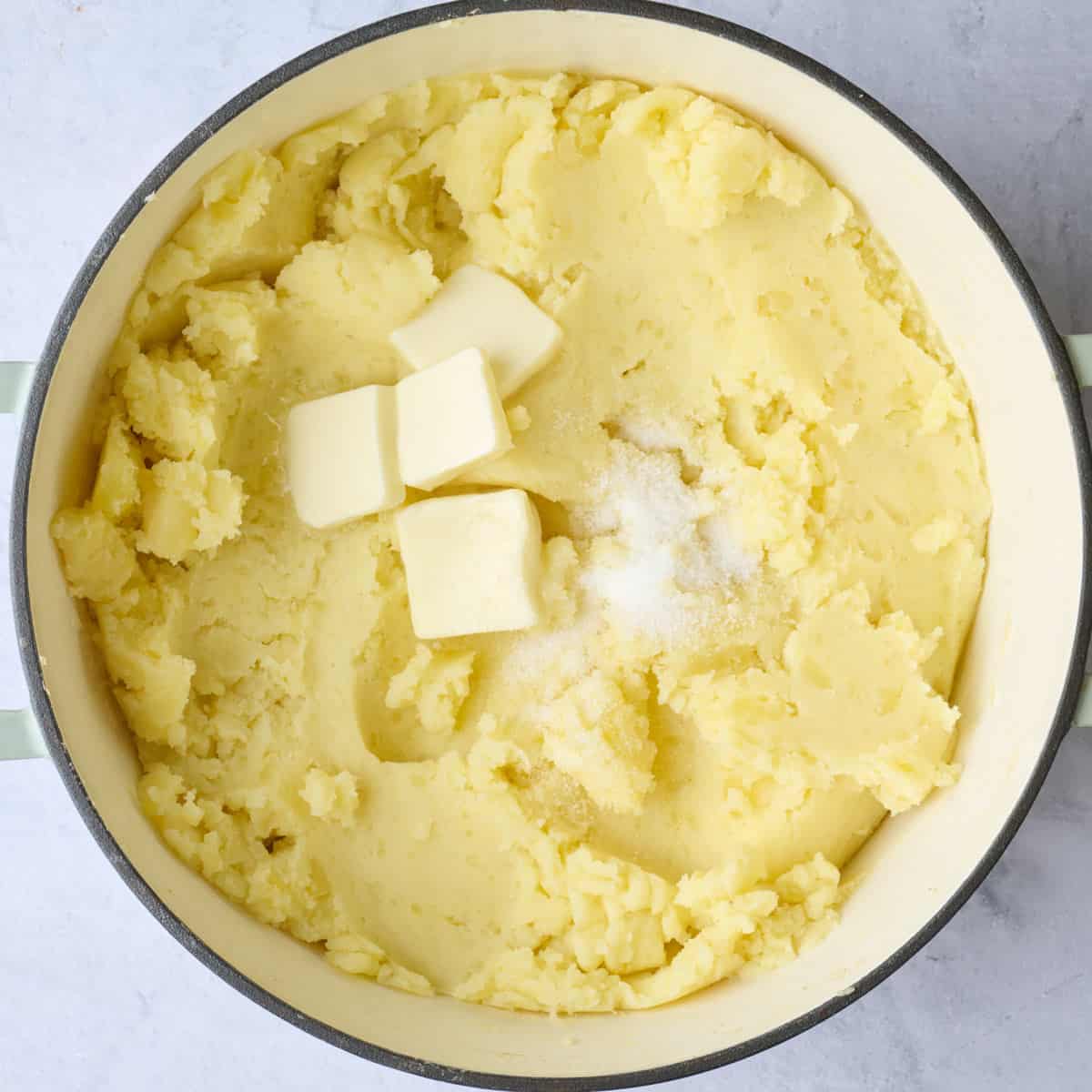 After mashing until smooth with slightly melted butter, and salt added on top.