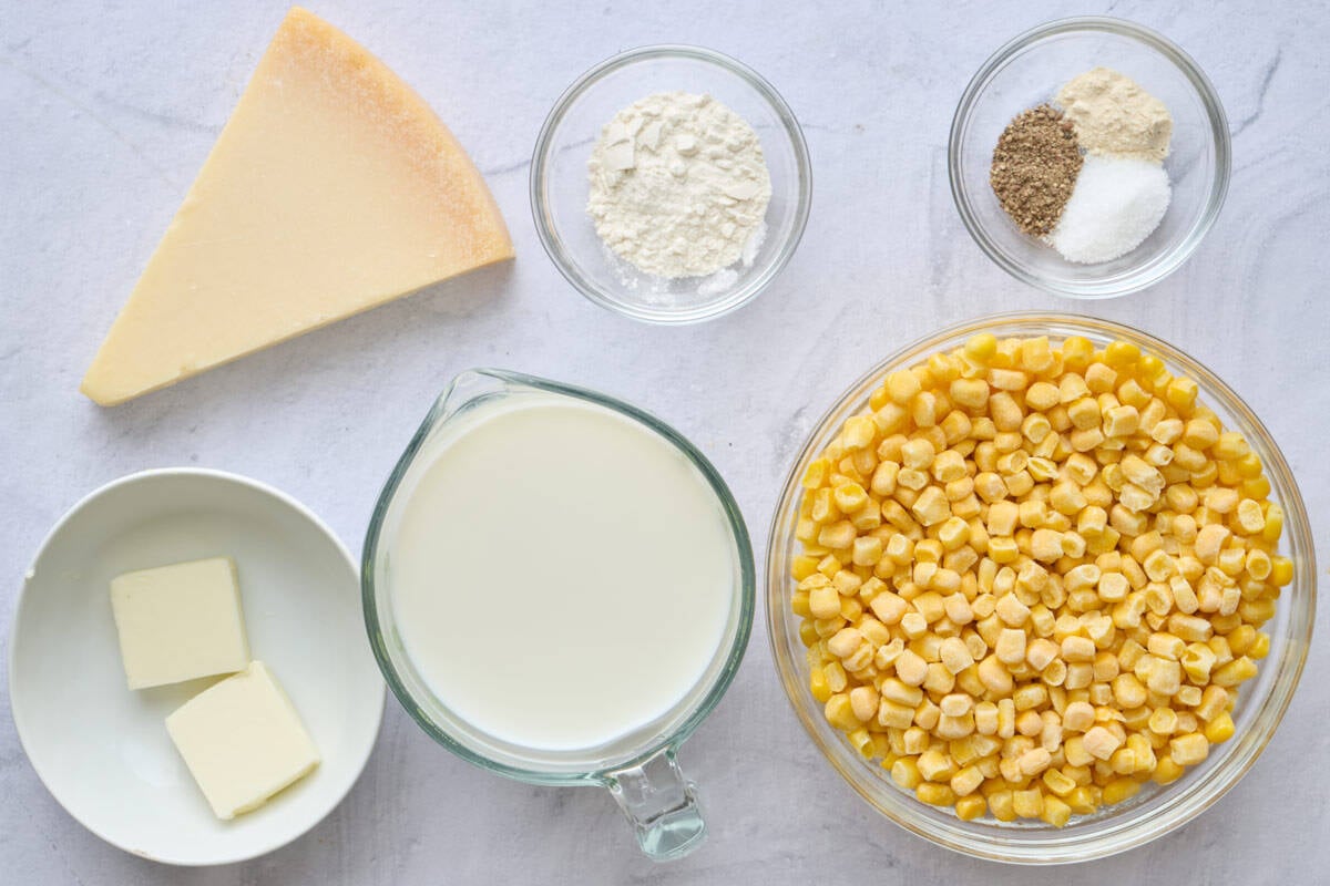 Ingredients for recipe: parmesan cheese, butter, milk, flour, seasonings, and frozen corn.