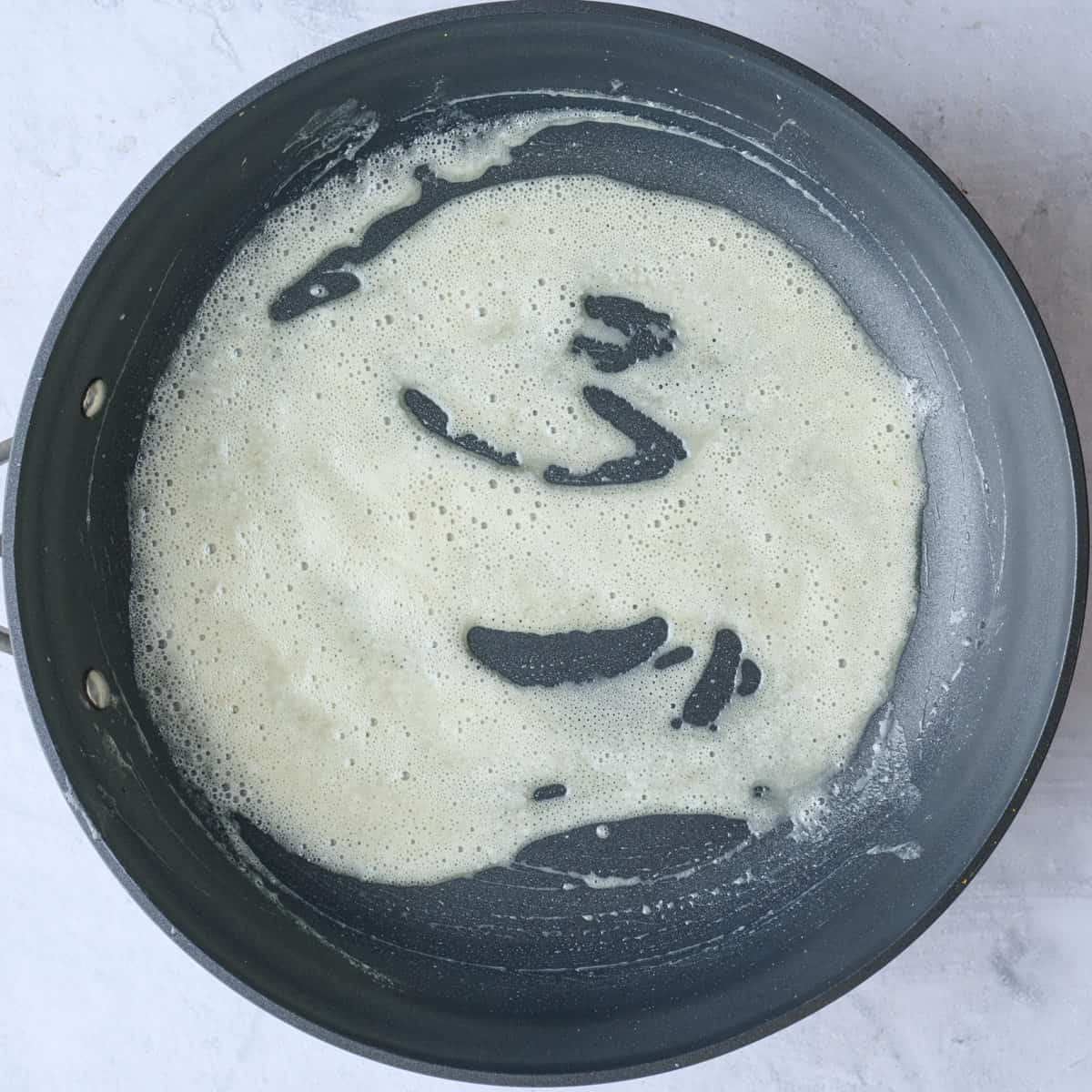 Melted butter and flour in a large skillet.