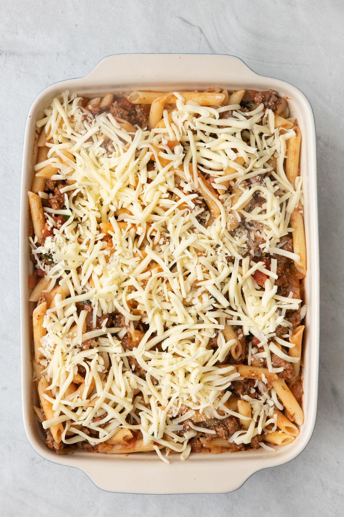 Shredded mozzarella added on top before baked.