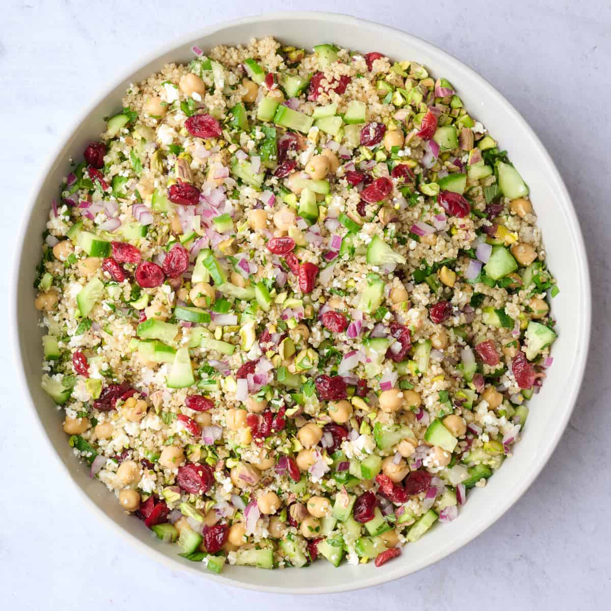 Healthy Jennifer Aniston salad in a bowl after tossing together.