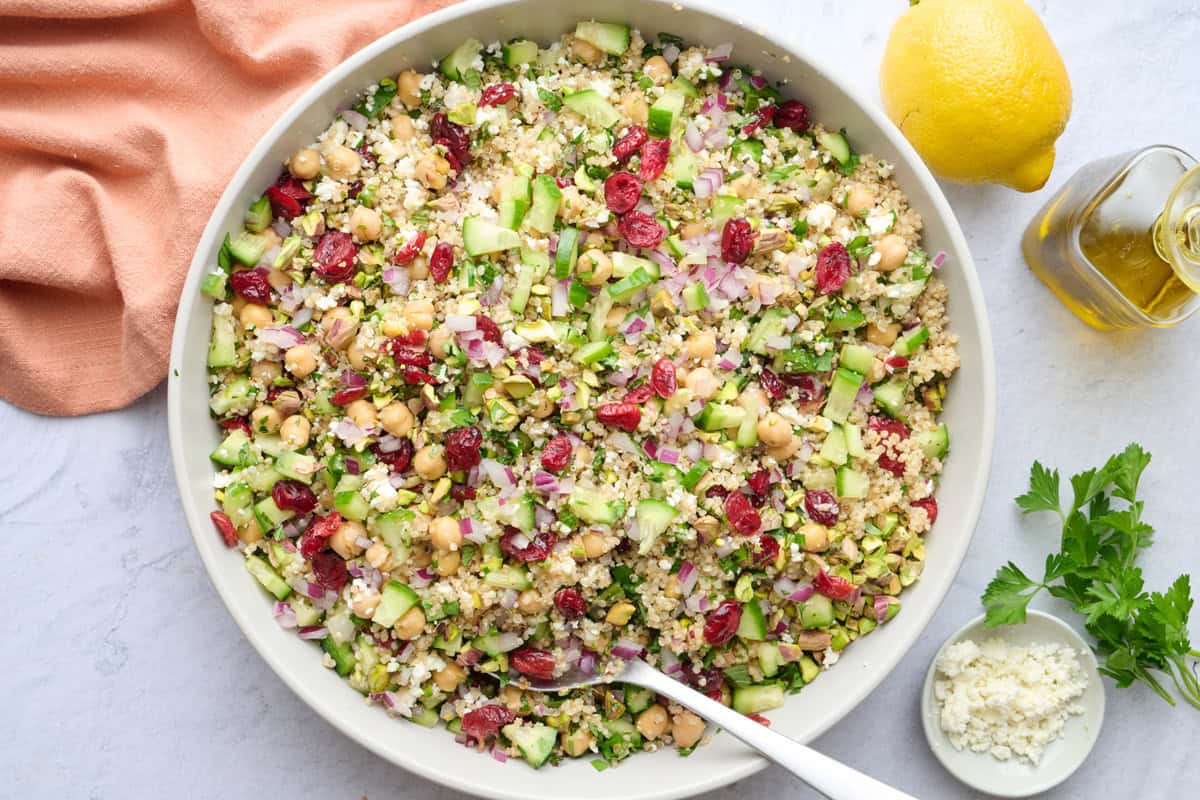 Viral Jennifer Aniston salad made with quinoa, chickpeas, dried cranberries, cucumbers and onions.