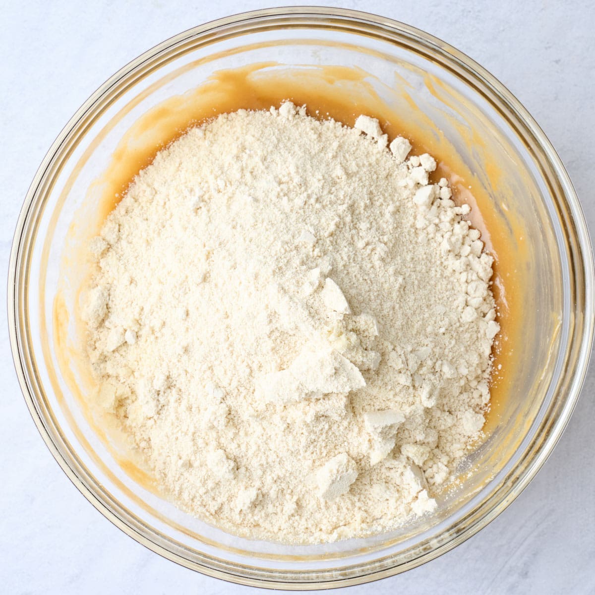 After combining with dry ingredients added on top.