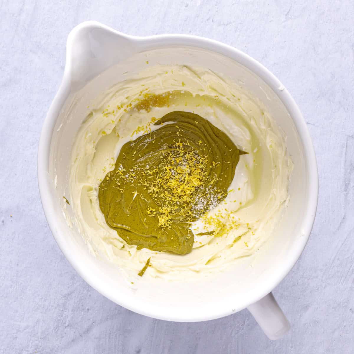 After mixing smooth with sour cream, pistachio paste, lemon juice/zest, and salt added.