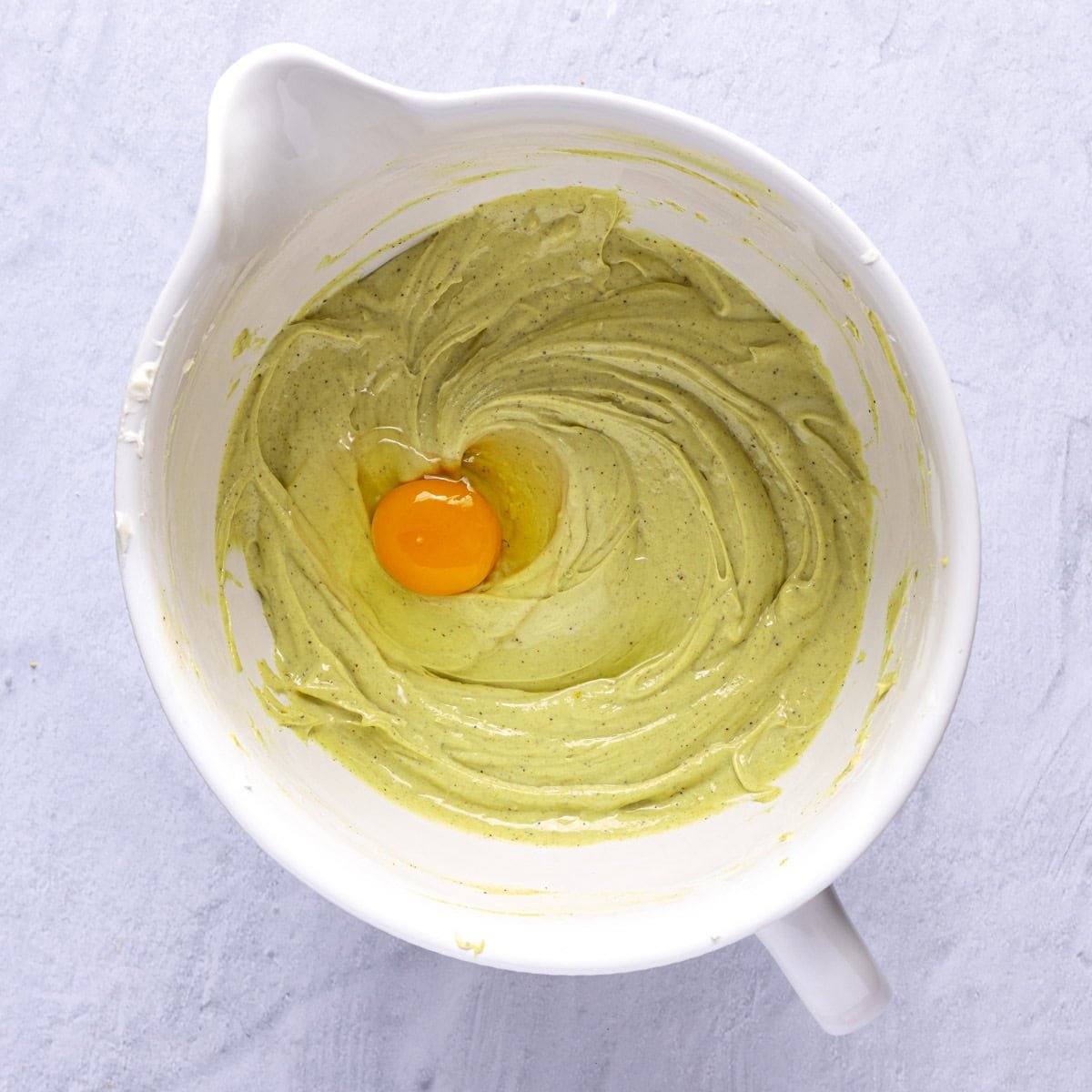 Egg added to cream cheese mixture.