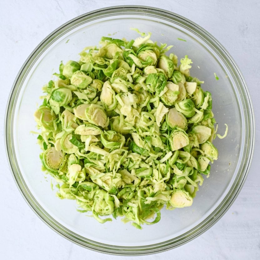 After tossing brussel sprouts with dressing in a bowl.