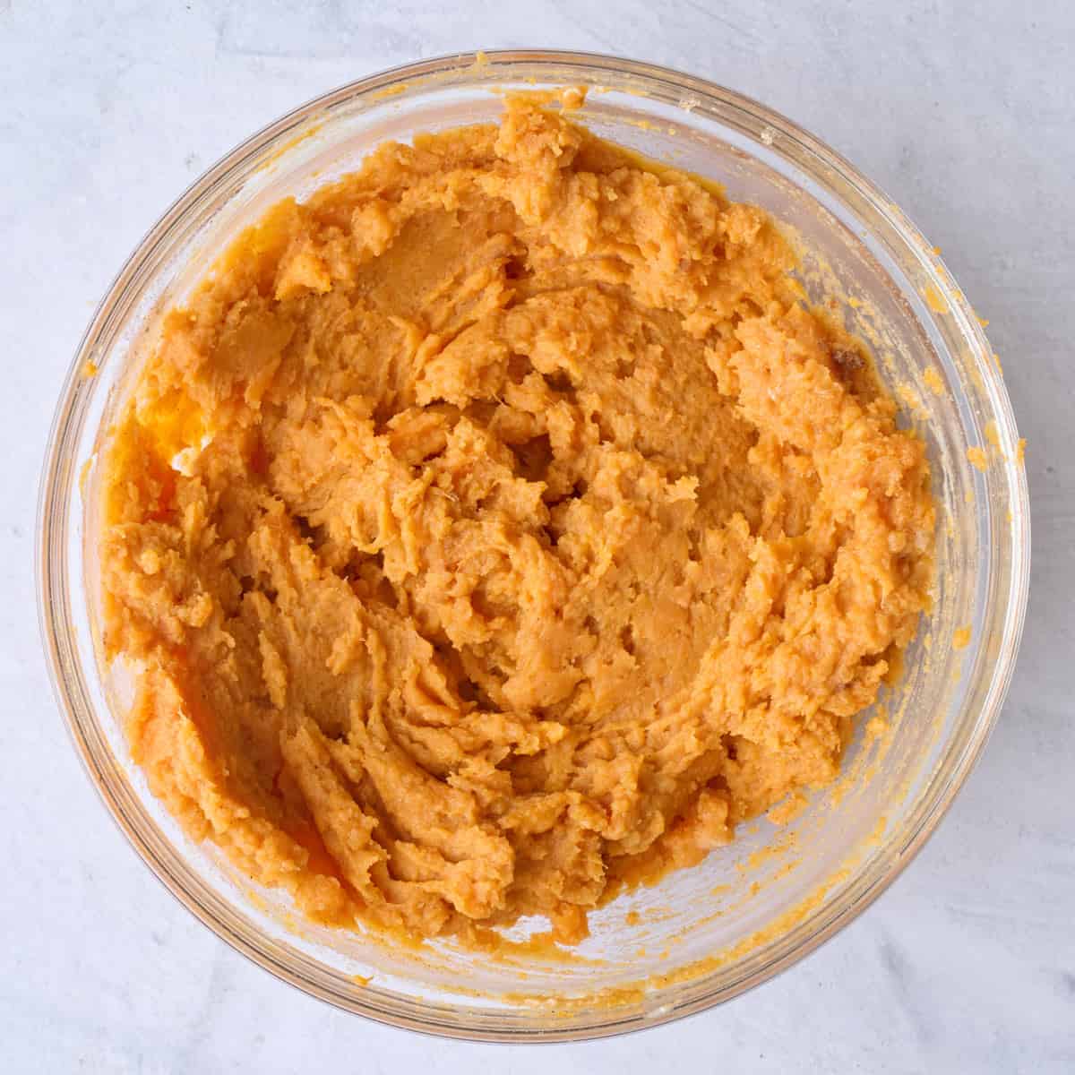 Mashed sweet potatoes in a bowl.