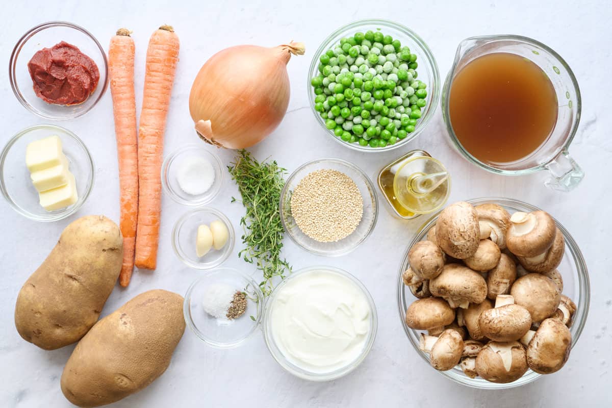 Ingredients for recipe: tomato paste, butter, potatoes, carrots, onion, garlic, seasonings, quinoa, yogurt, frozen peas, broth, oil and mushrooms.