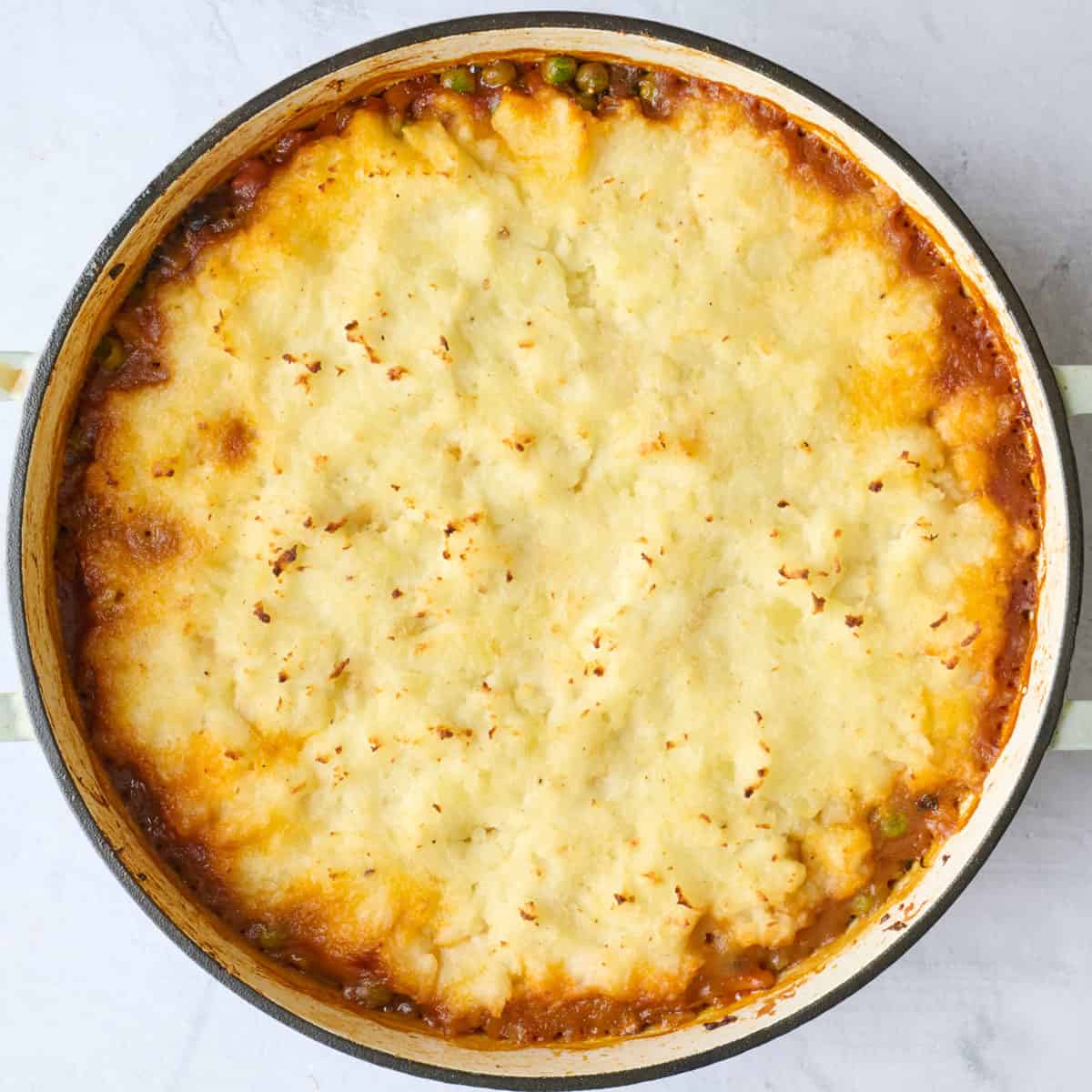 Recipe after baking to show a golden crust on mashed potatoes.